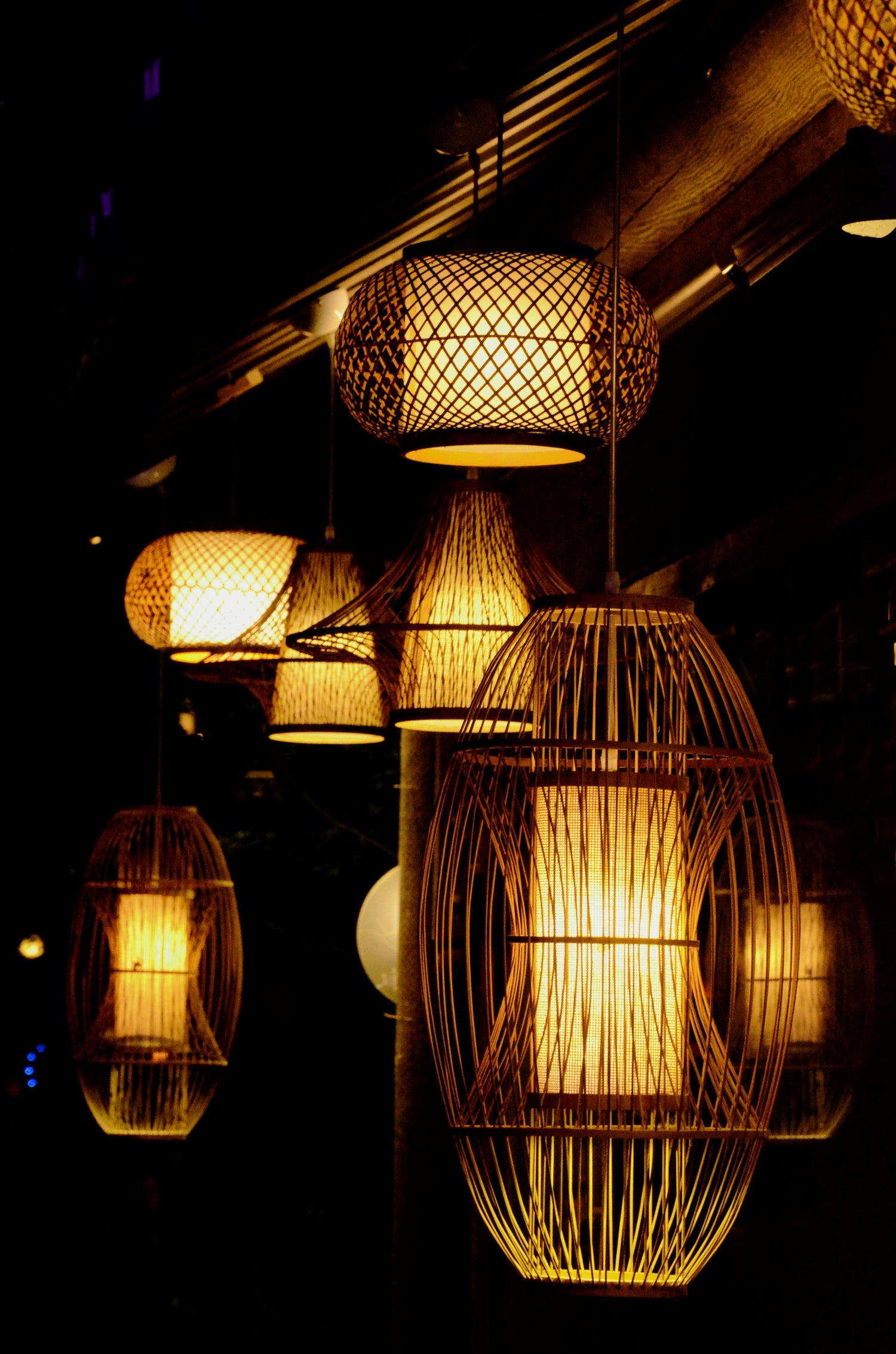 Warm ambient rattan pendant lights handcrafted from bamboo and seagrass fibers